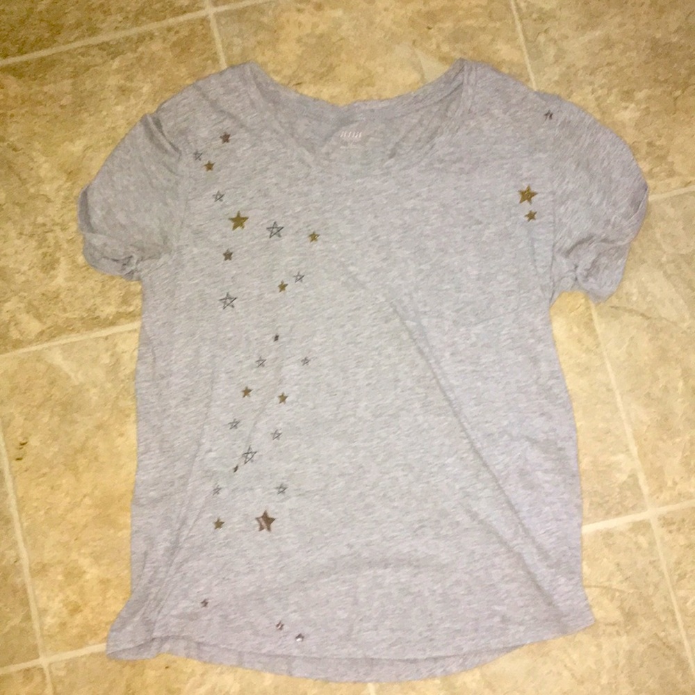 This shirt has gold and silver stars